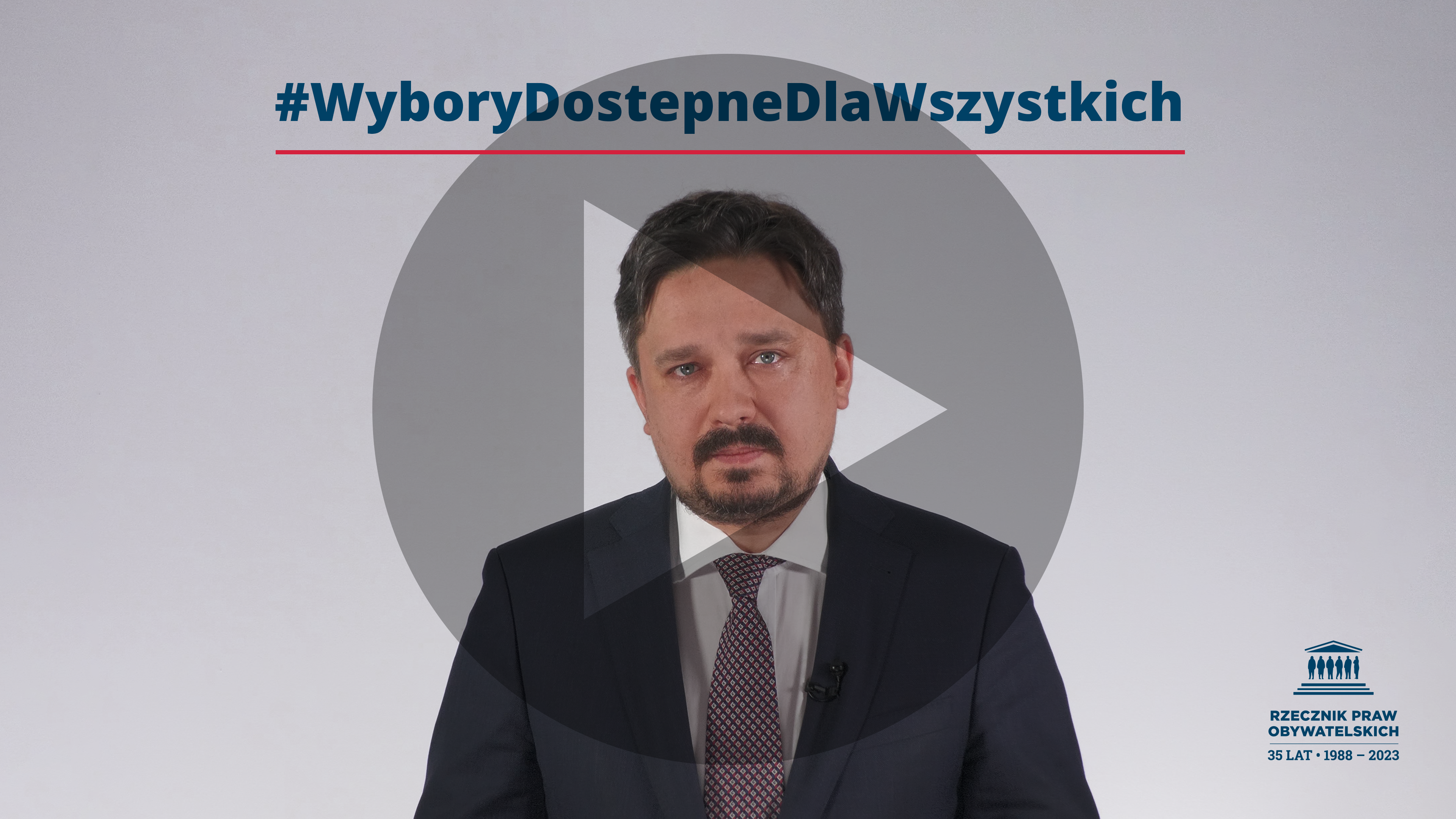 Plansza przedstawiająca RPO Marcina Wiącka, tekst WyboryDostepneDlaWszystkich i symbol odtwarzania trójkąt w kole