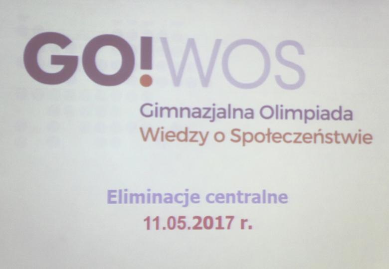 Plansza informacyjna Gimnazjalnej Olimpiady Wiedzy o Społeczeństwie