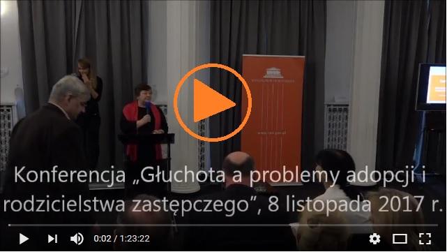 grafika: kilka osób siedzi na sali konferencyjnej