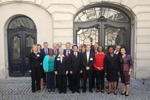 Memebers of the IOI World Board In front of a building